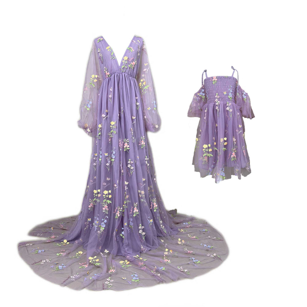 Mon and little girl's purple butterfly floral embroidered dresses on mannequin.