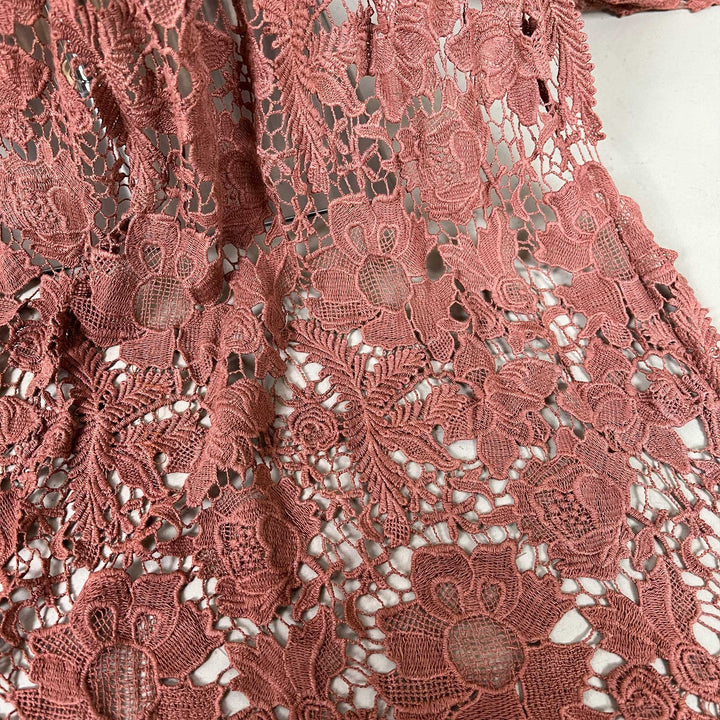 A high-waisted floor-length skirt with  sweeping train.