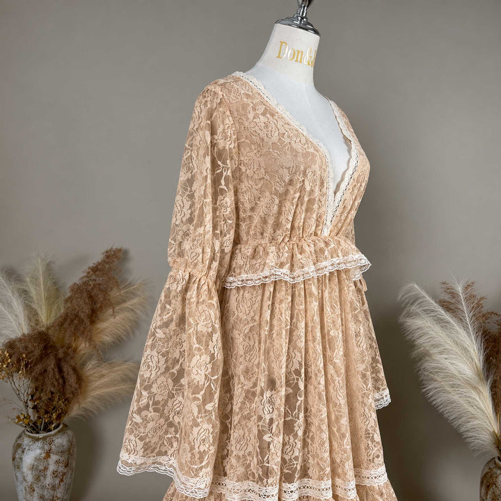 A close-up of the Clito khaki lace dress bodice, showing the V neckline, waist ruffle and sleeve with a tie.