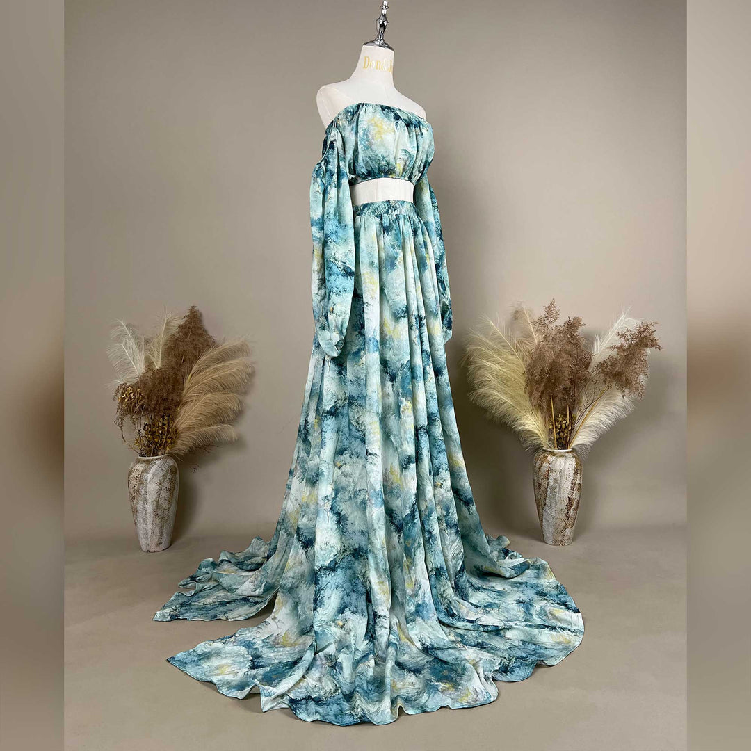A Hestia tie dye print off-shoulder top and long skirt with a train are displayed on a mannequin. 