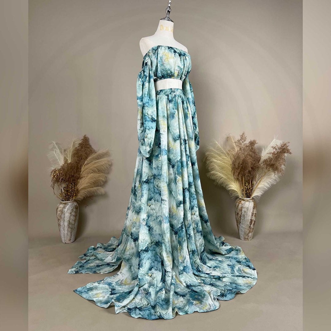 A Hestia tie dye print off-shoulder top and long skirt with a train are displayed on a mannequin. 