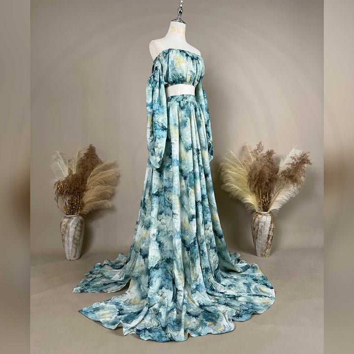 A Hestia tie dye print off-shoulder top and long skirt with a train are displayed on a mannequin. 