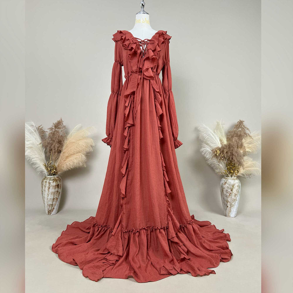 Kallectoria terracotta long-sleeved tiered ruffle maternity photography dress displayed on a mannequin.