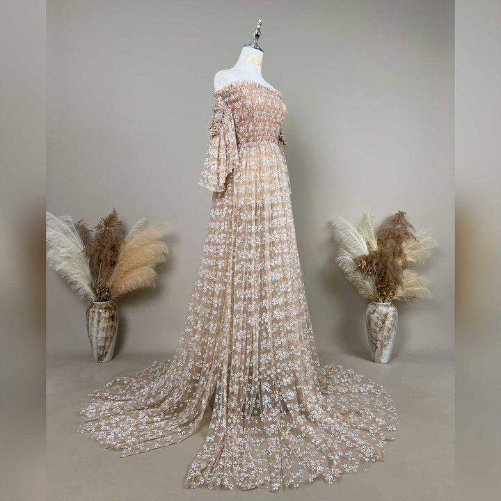 lysianassa dress with floral embroidered off shoulder tulle details is displayed on a mannequin against a neutral gray background