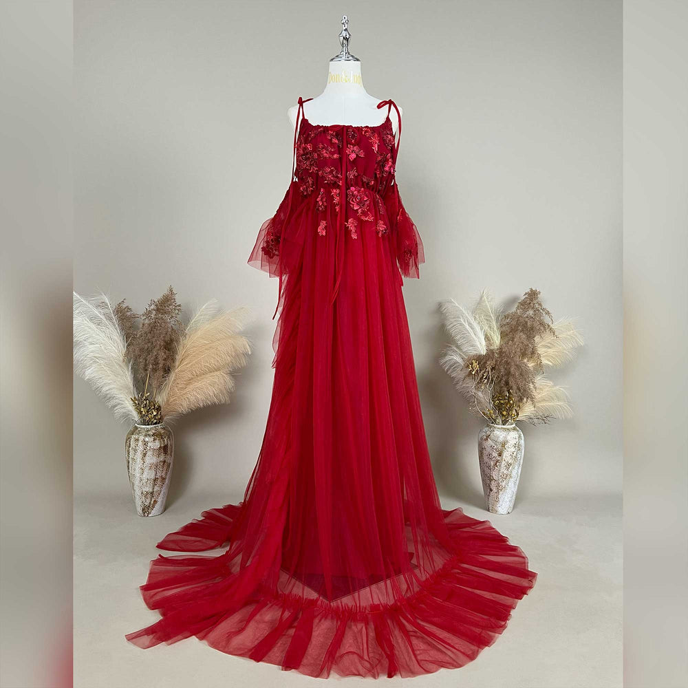 A Oreades red floral embroidered off-shoulder tiered ruffle maternity photography dress on a mannequin.