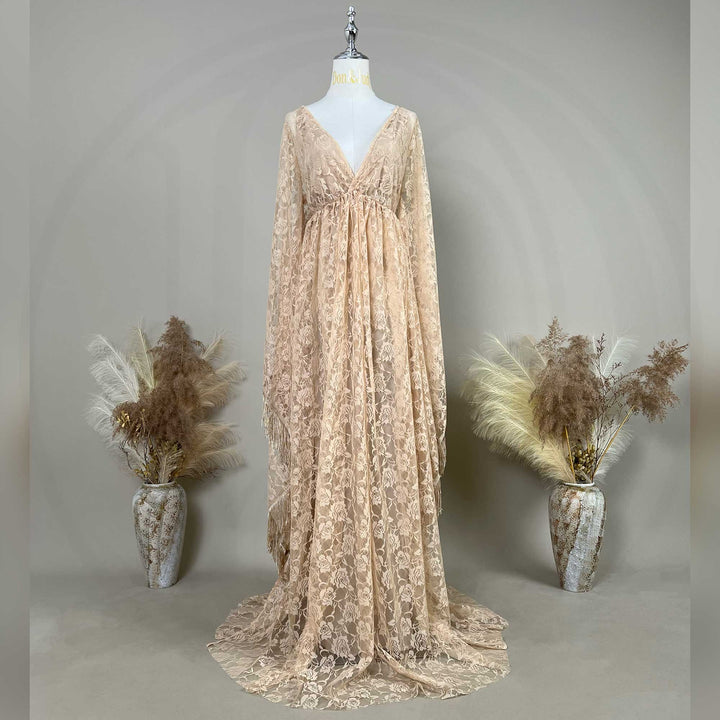 A khaki rose lace V-neck gown is displayed on a mannequin, featuring a ruched high waistline and wide bell sleeves.