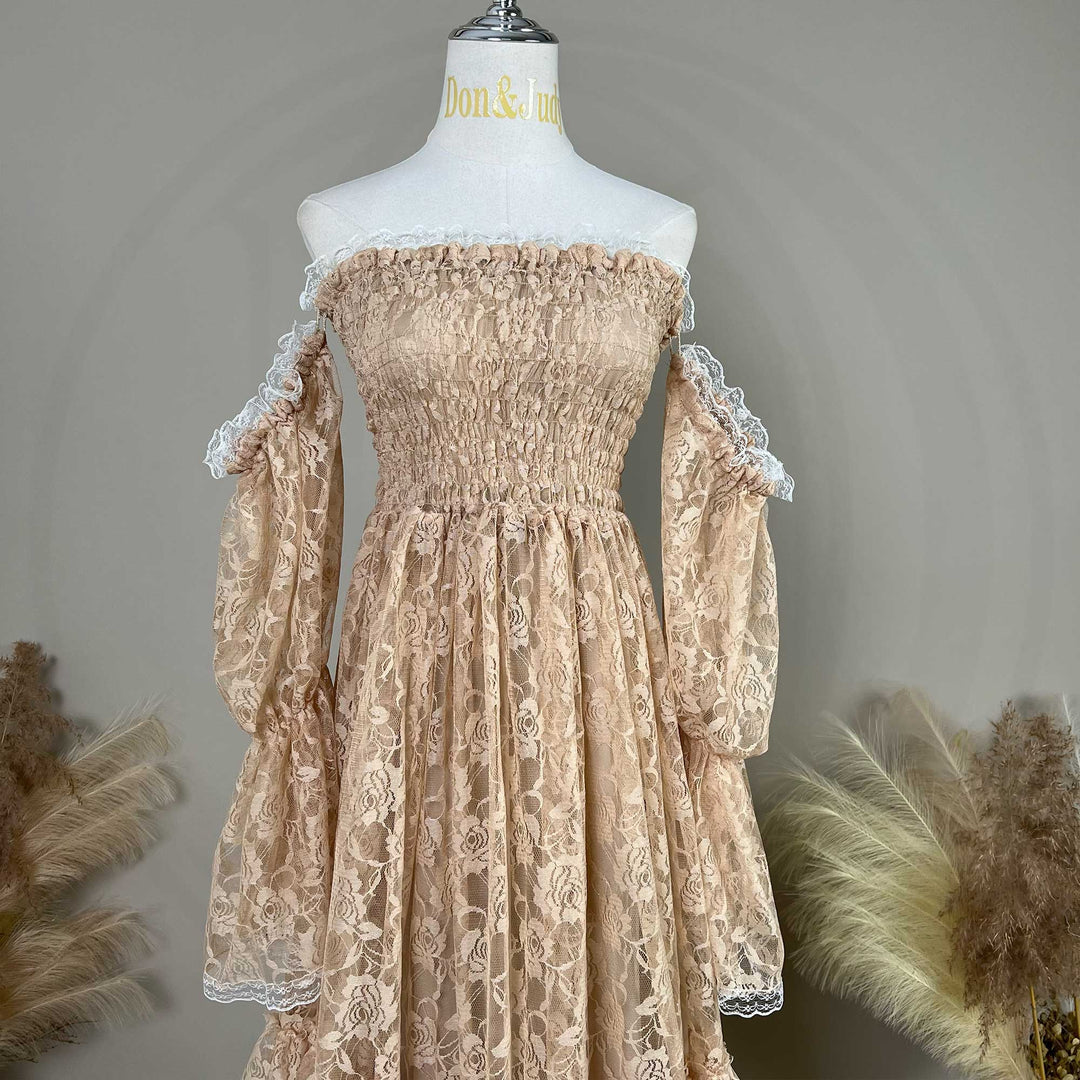 A khaki lace off-shoulder dress is displayed on a mannequin, featuring a shirred bodice, tiered ruffled sleeves, and rose patterns.